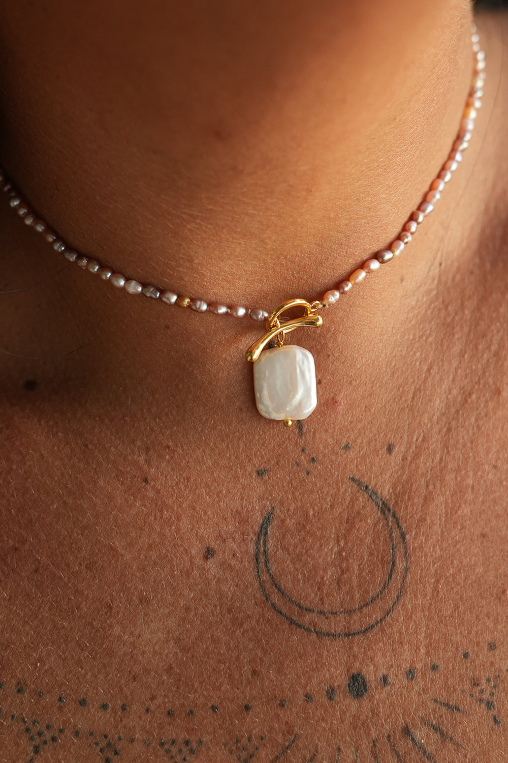 Shop the Baroque Pearl Necklace in Pink, with seed pearls and a luminous baroque pearl pendant from the Earth Altering collection by Jinx the Label.