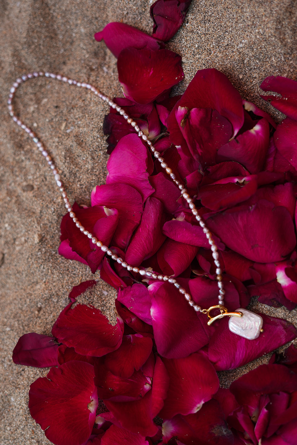 Shop the Baroque Pearl Necklace in Pink, with seed pearls and a luminous baroque pearl pendant from the Earth Altering collection by Jinx the Label.