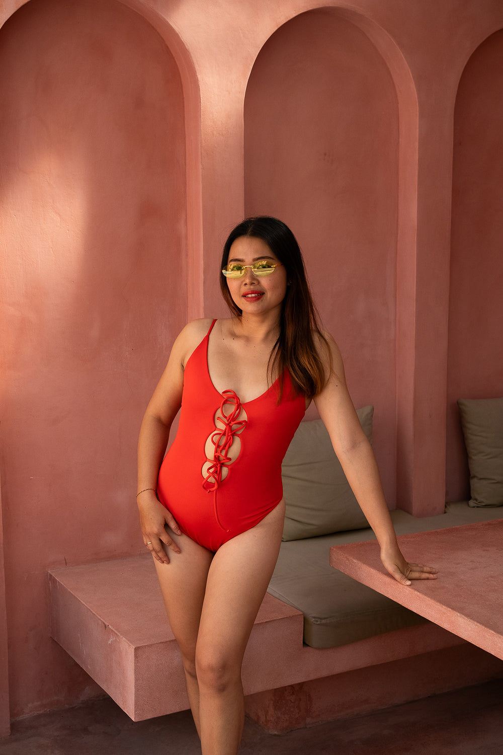 The Calypso One Piece in Orange by Jinx the Label. Ethically handmade in Bali with an adjustable lace-up front, flattering fit and inclusive sizing.