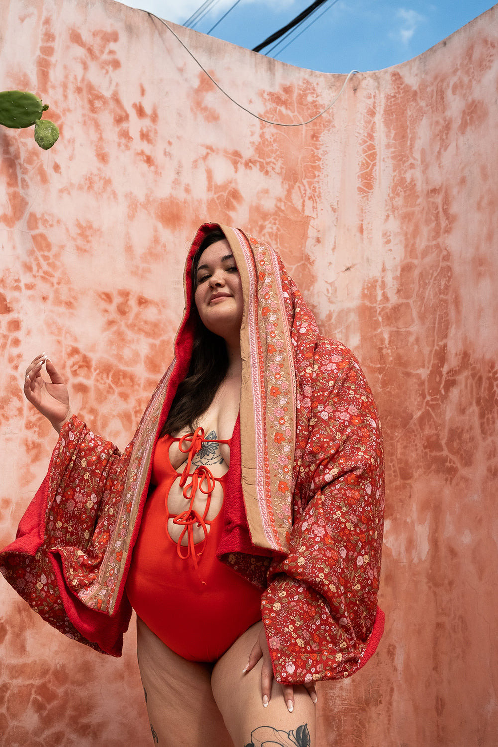 The Calypso One Piece in Orange by Jinx the Label. Ethically handmade in Bali with an adjustable lace-up front, flattering fit and inclusive sizing.