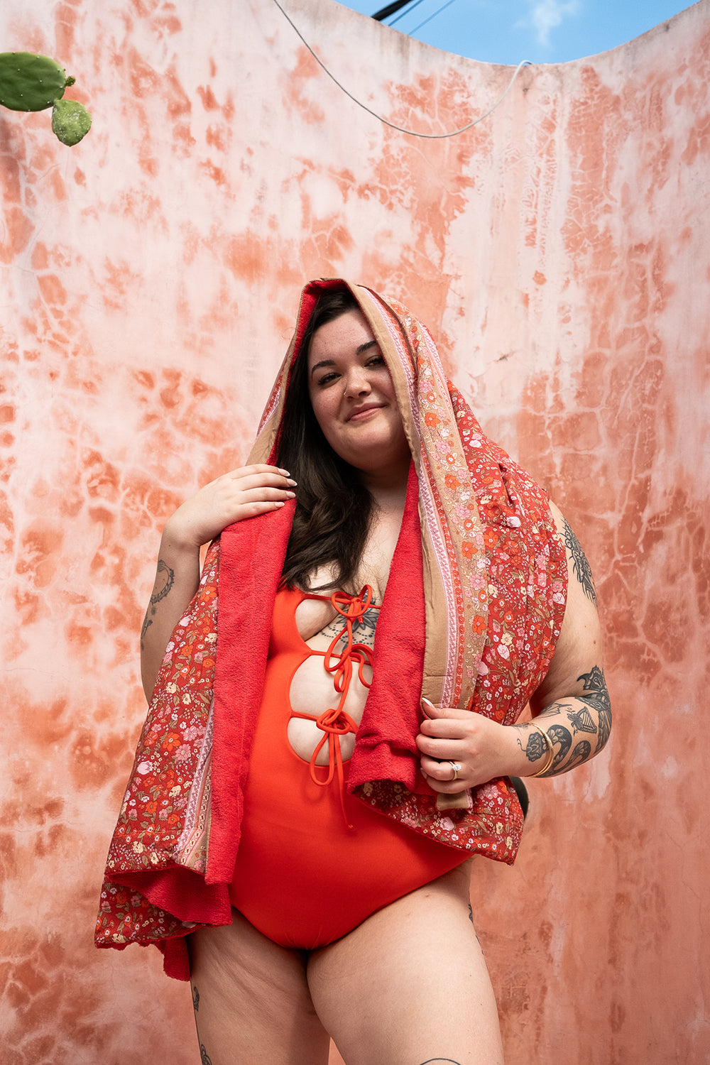 The Calypso One Piece in Orange by Jinx the Label. Ethically handmade in Bali with an adjustable lace-up front, flattering fit and inclusive sizing.