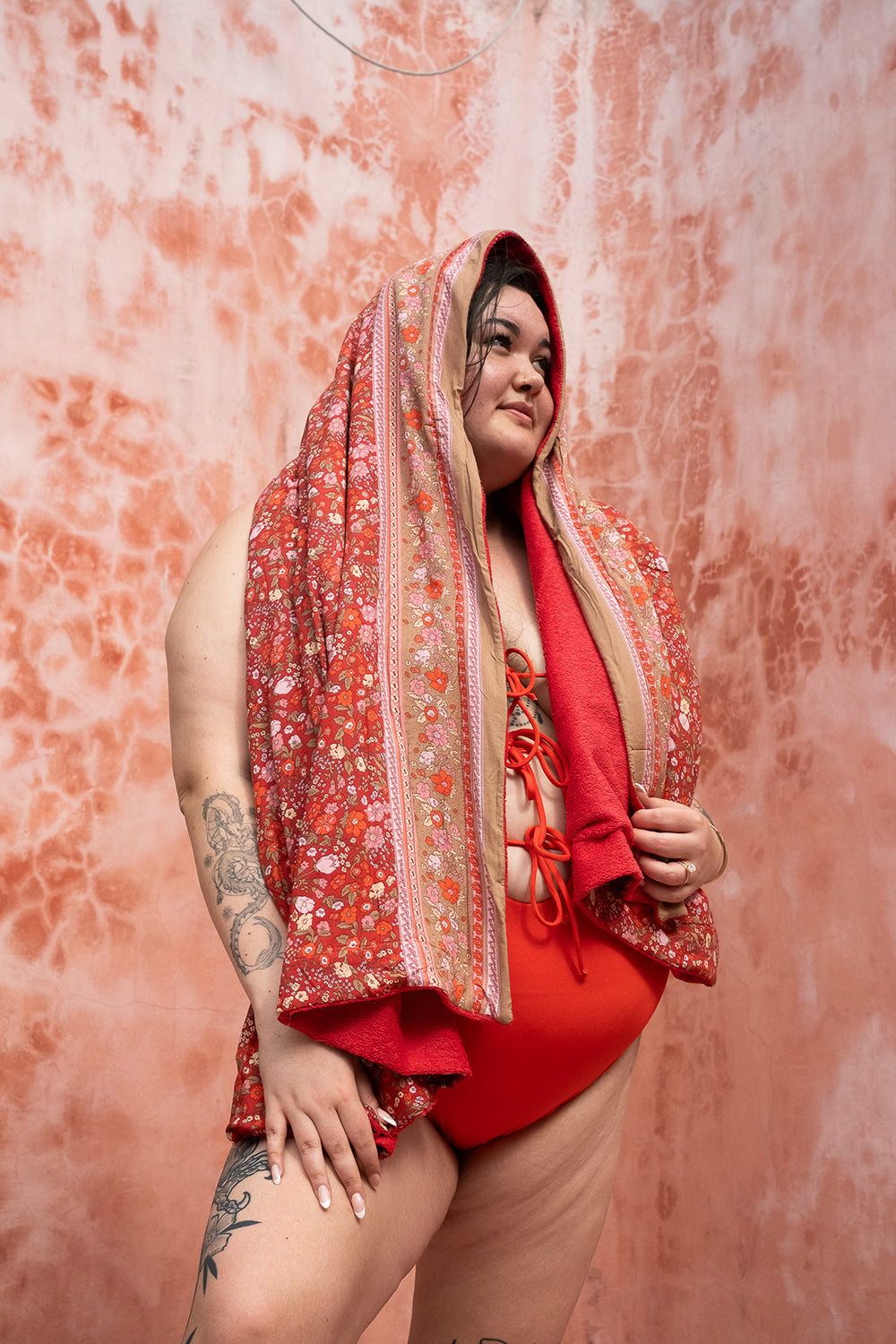 The Calypso One Piece in Orange by Jinx the Label. Ethically handmade in Bali with an adjustable lace-up front, flattering fit and inclusive sizing.