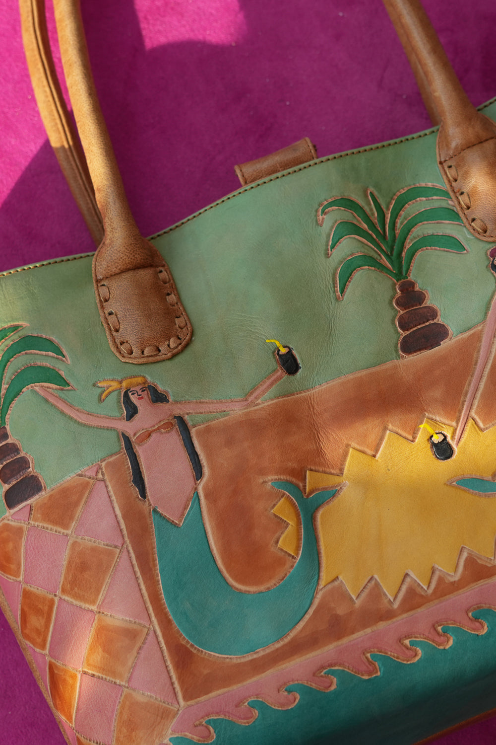 Meet the Desert Siren Tote in Sage and Caramel. A handcrafted leather tote with hand tooled motives artwork, long handles and practical interior compartments.