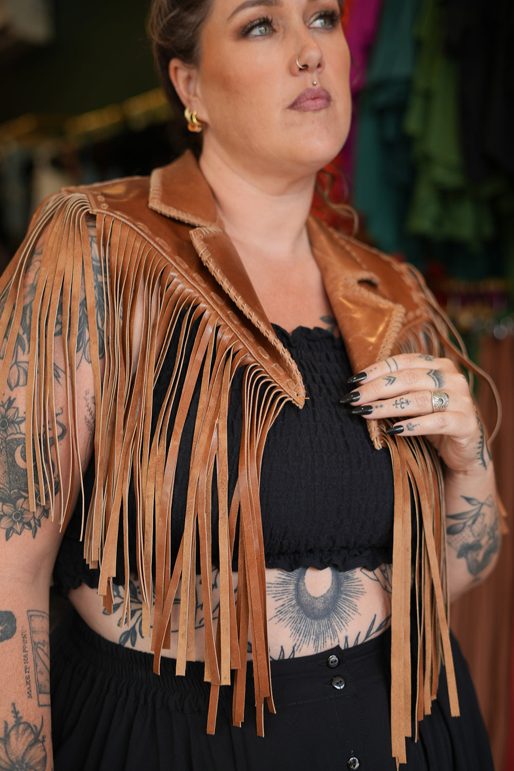 Meet the Nevada Cape in Brown, handcrafted from 100% genuine leather with cascading fringe, Western detailing and statement stars. Handmade with love.