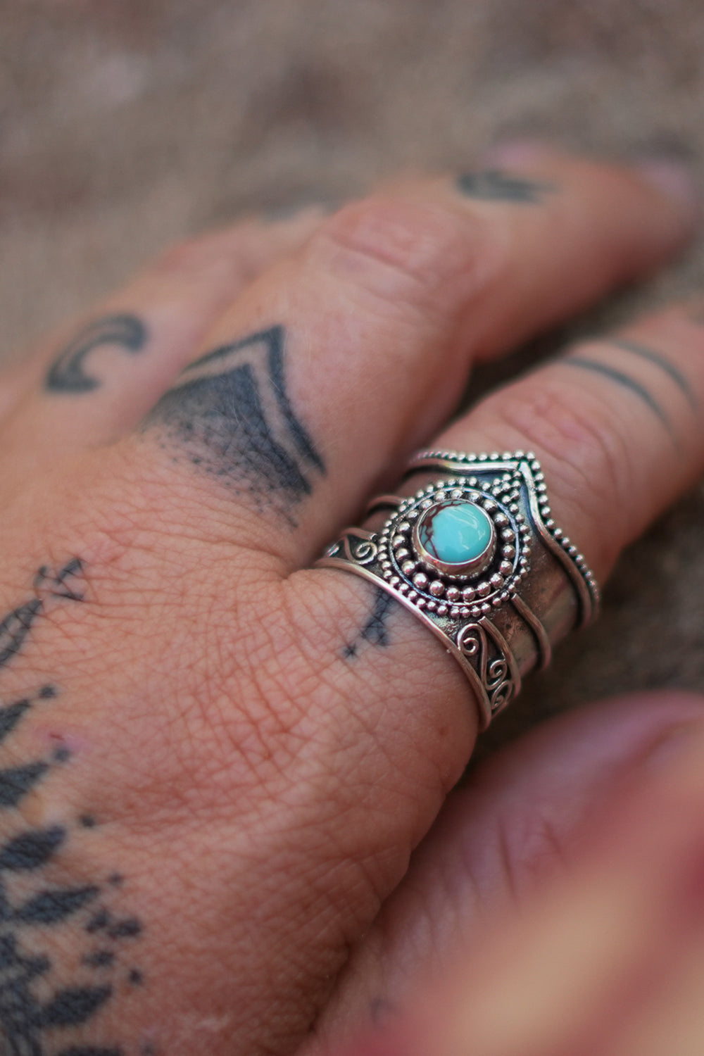 Discover the Nomad Ring by Jinx the Label, a statement sterling silver ring featuring natural turquoise, intricate scrollwork and bohemian detailing.
