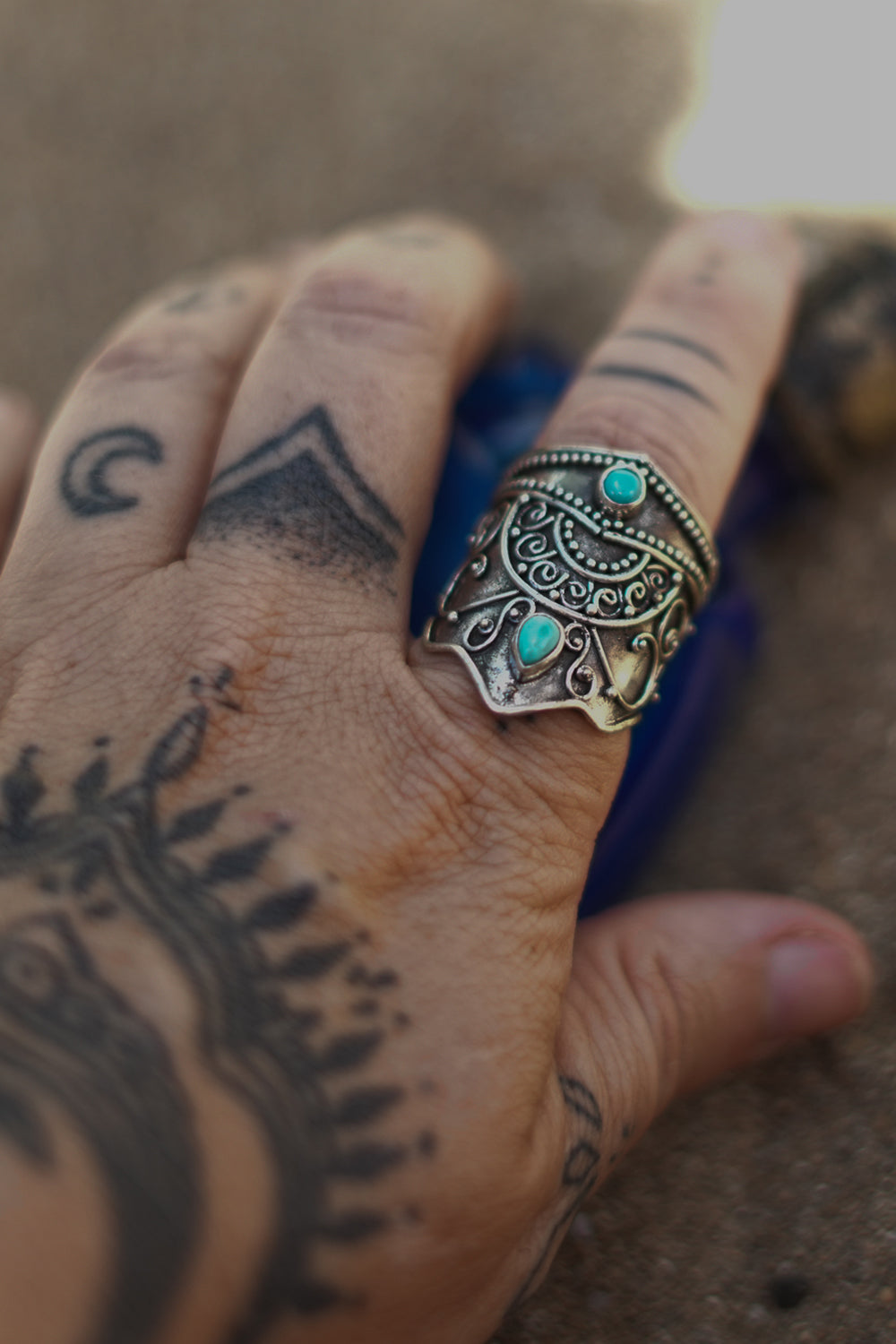Discover the Wanderer Ring by Jinx the Label, an ornate sterling silver statement ring featuring natural turquoise stones and intricate bohemian detailing.