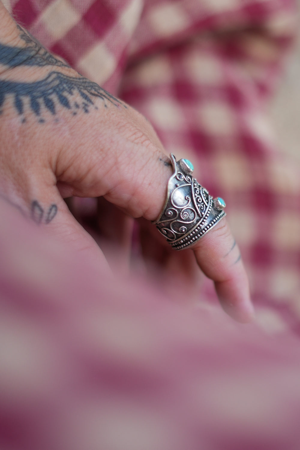 Discover the Wanderer Ring by Jinx the Label, an ornate sterling silver statement ring featuring natural turquoise stones and intricate bohemian detailing.