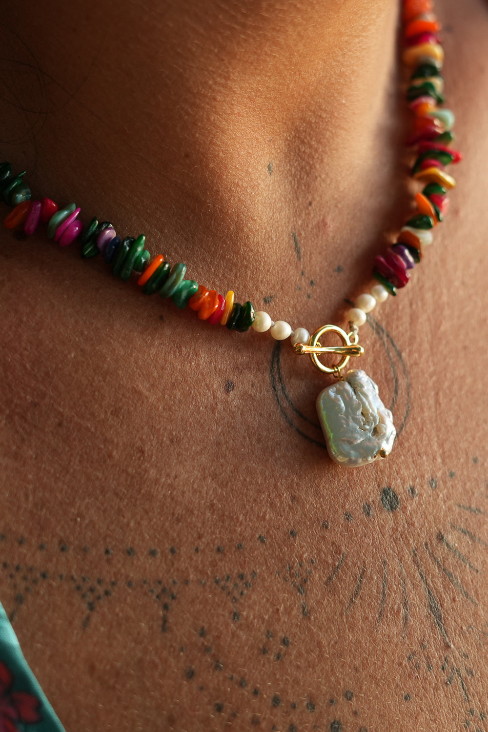 Shop the Wanderlust Necklace in Rainbow Pearl, with colorful chip beads, creamy pearls and a baroque pearl pendant from Earth Altering by Jinx the Label.