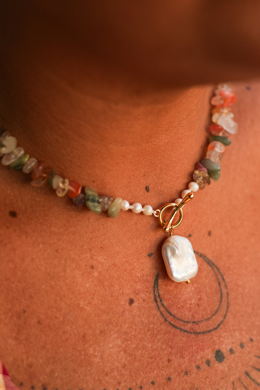 Discover the Wild Earth Necklace in Desert Bloom, with natural stone chips, freshwater pearls and a statement pearl pendant from Earth Altering by Jinx the Label.