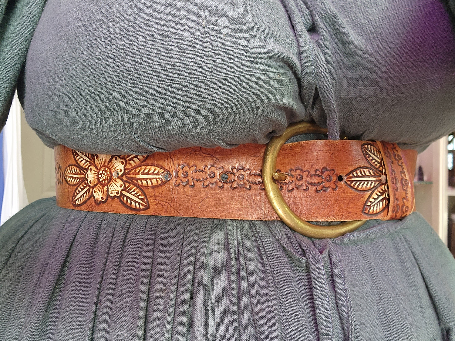 Embossed tan leather belt circle details