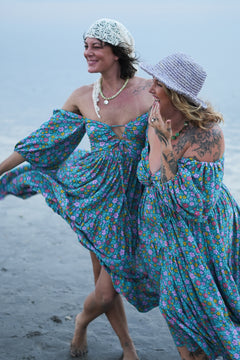 Meet the Amazonian Maxi Dress in Aqua Bloom, a flowing rayon floral maxi with an off-shoulder neckline, keyhole bodice, balloon sleeves and sweeping tiers.