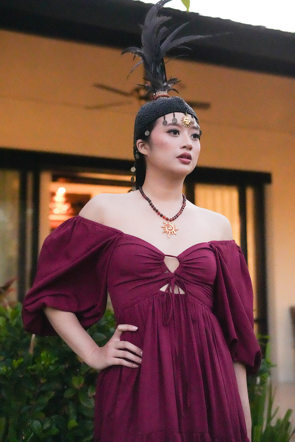 Meet the Amazonian Maxi Dress in Maroon, a flowing rayon maxi with an off shoulder neckline, keyhole bodice, balloon sleeves and sweeping tiers.