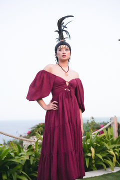 Meet the Amazonian Maxi Dress in Maroon, a flowing rayon maxi with an off shoulder neckline, keyhole bodice, balloon sleeves and sweeping tiers.