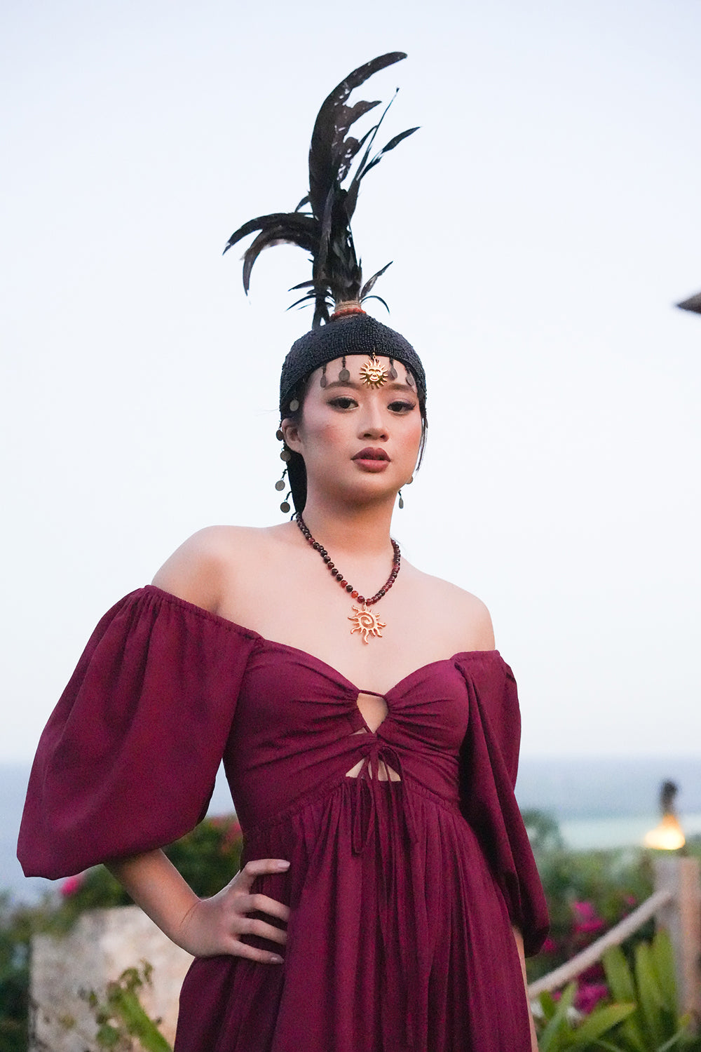 Meet the Amazonian Maxi Dress in Maroon, a flowing rayon maxi with an off shoulder neckline, keyhole bodice, balloon sleeves and sweeping tiers.