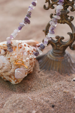 Shop the Amethyst Moon Necklace in Amethyst, with organic stone chips, petite pearls, gold toggle and a baroque pearl pendant by Jinx the Label.