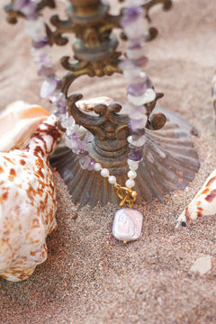 Shop the Amethyst Moon Necklace in Amethyst, with organic stone chips, petite pearls, gold toggle and a baroque pearl pendant by Jinx the Label.