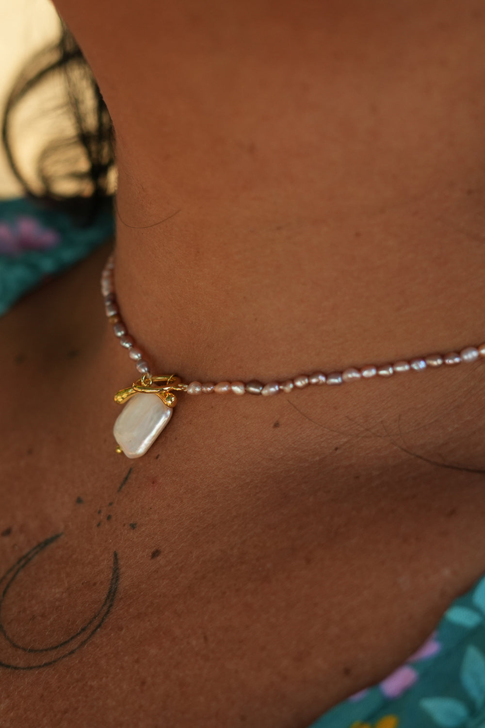 Shop the Baroque Pearl Necklace in Pink, with seed pearls and a luminous baroque pearl pendant from the Earth Altering collection by Jinx the Label.