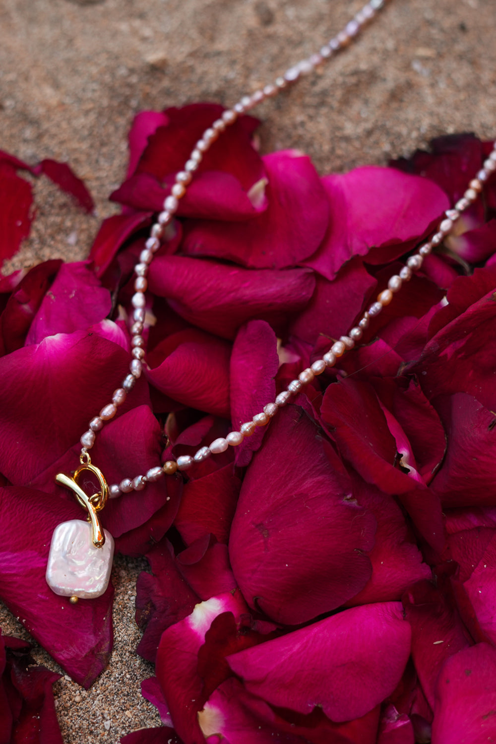 Shop the Baroque Pearl Necklace in Pink, with seed pearls and a luminous baroque pearl pendant from the Earth Altering collection by Jinx the Label.