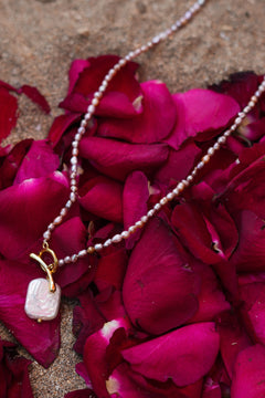 Shop the Baroque Pearl Necklace in Pink, with seed pearls and a luminous baroque pearl pendant from the Earth Altering collection by Jinx the Label.