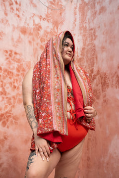 The Calypso One Piece in Orange by Jinx the Label. Ethically handmade in Bali with an adjustable lace-up front, flattering fit and inclusive sizing.