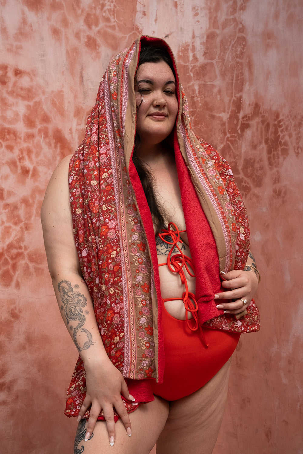The Calypso One Piece in Orange by Jinx the Label. Ethically handmade in Bali with an adjustable lace-up front, flattering fit and inclusive sizing.