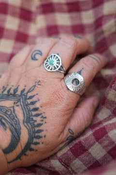 Discover the Eclipse Ring by Jinx the Label, a bold sterling silver statement ring featuring an open centre and hand worked celestial sunburst detailing.
