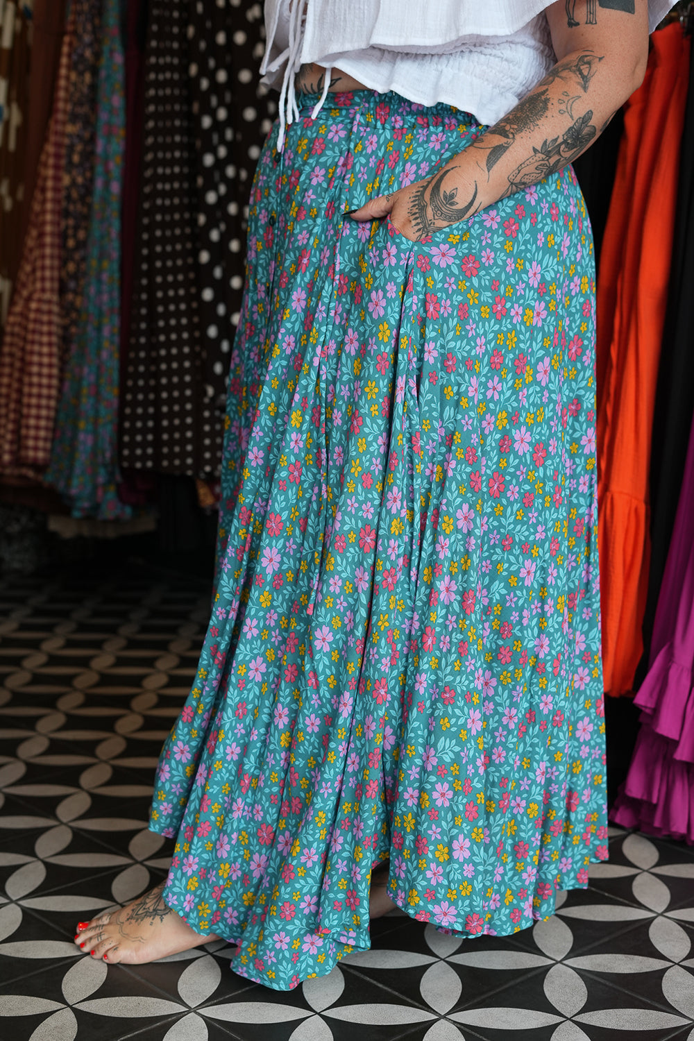 Meet the Fae Skirt in Aqua Bloom, a flowing floral boho maxi with an elastic waist, drawstring, buttons and pockets. Wear it as a skirt or strapless dress.