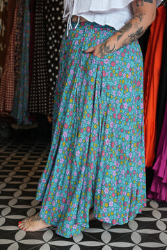 Meet the Fae Skirt in Aqua Bloom, a flowing floral boho maxi with an elastic waist, drawstring, buttons and pockets. Wear it as a skirt or strapless dress.