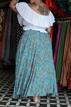 Meet the Fae Skirt in Aqua Bloom, a flowing floral boho maxi with an elastic waist, drawstring, buttons and pockets. Wear it as a skirt or strapless dress.