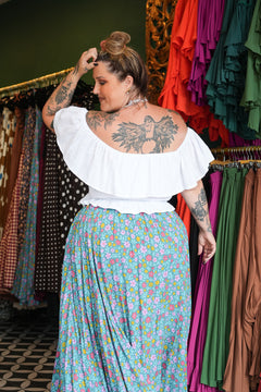 Meet the Fae Skirt in Aqua Bloom, a flowing floral boho maxi with an elastic waist, drawstring, buttons and pockets. Wear it as a skirt or strapless dress.