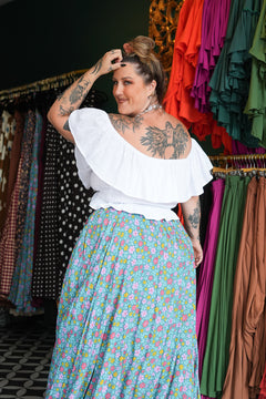 Meet the Fae Skirt in Aqua Bloom, a flowing floral boho maxi with an elastic waist, drawstring, buttons and pockets. Wear it as a skirt or strapless dress.