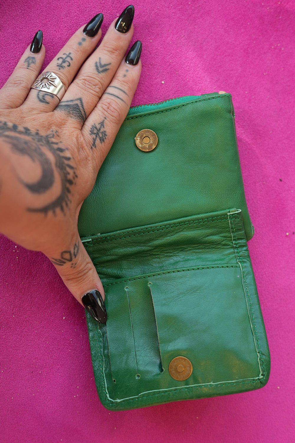 Meet the Freebird Mini Wallet in Cactus Green, a handcrafted leather wallet with hummingbird artwork, woven detailing, turquoise accent and card compartments.
