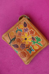 Meet the Freebird Mini Wallet in Desert Honey, a handcrafted leather wallet with colorful flowers, hummingbirds, ladybirds and butterfly artwork.