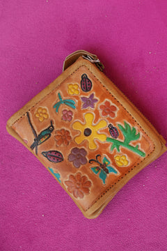 Meet the Freebird Mini Wallet in Desert Honey, a handcrafted leather wallet with colorful flowers, hummingbirds, ladybirds and butterfly artwork.