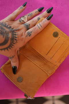 Meet the Freebird Mini Wallet in Desert Honey, a handcrafted leather wallet with colorful flowers, hummingbirds, ladybirds and butterfly artwork.