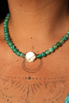 Shop the Gaia Pearl Necklace in Forest Agate, featuring green natural stone beads, an organic statement pearl and delicate gold toned details by Jinx the Label.