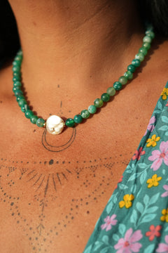 Shop the Gaia Pearl Necklace in Forest Agate, featuring green natural stone beads, an organic statement pearl and delicate gold toned details by Jinx the Label.