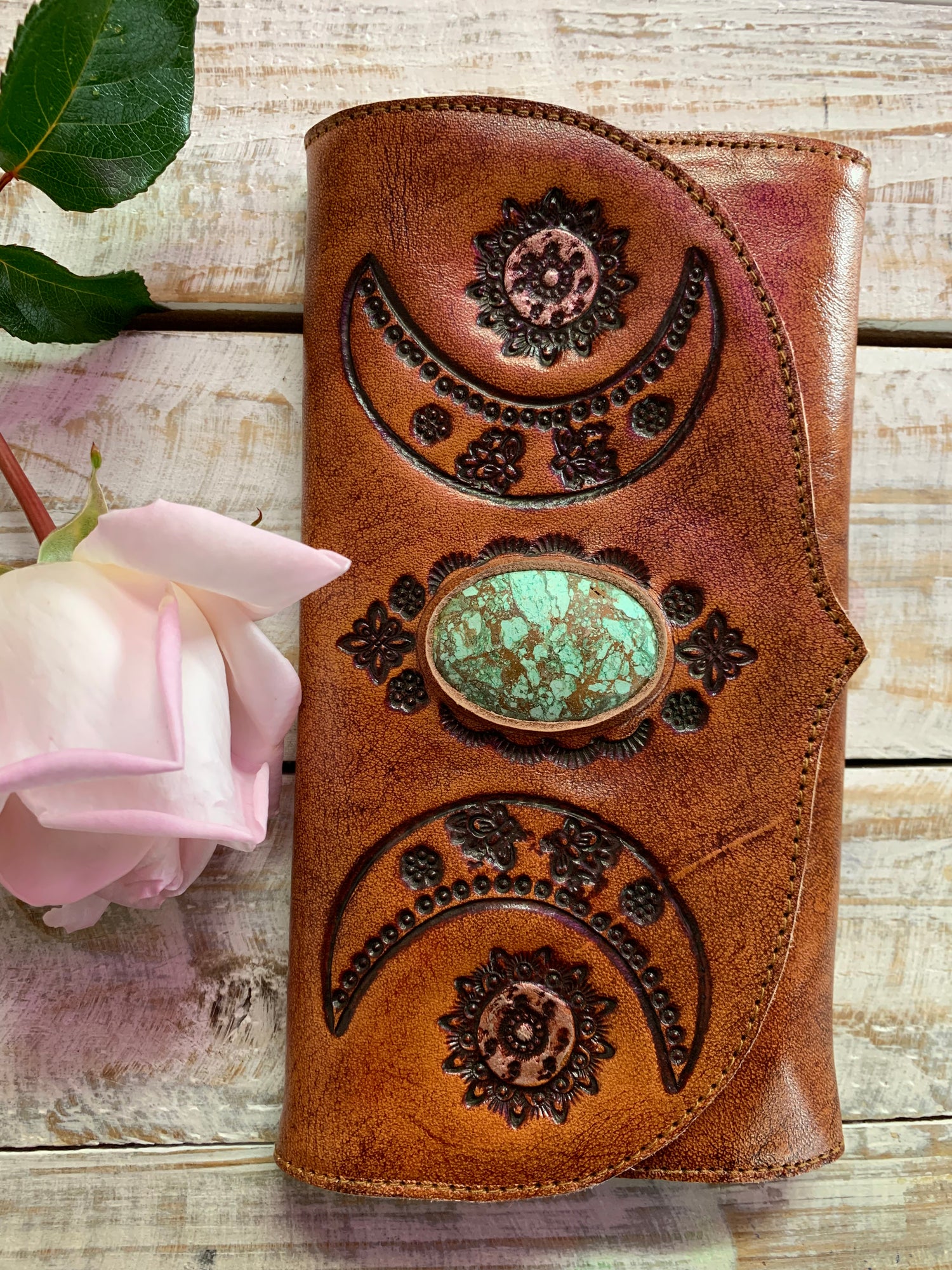 Hand tooled leather purse with chrysocolla crystal feature