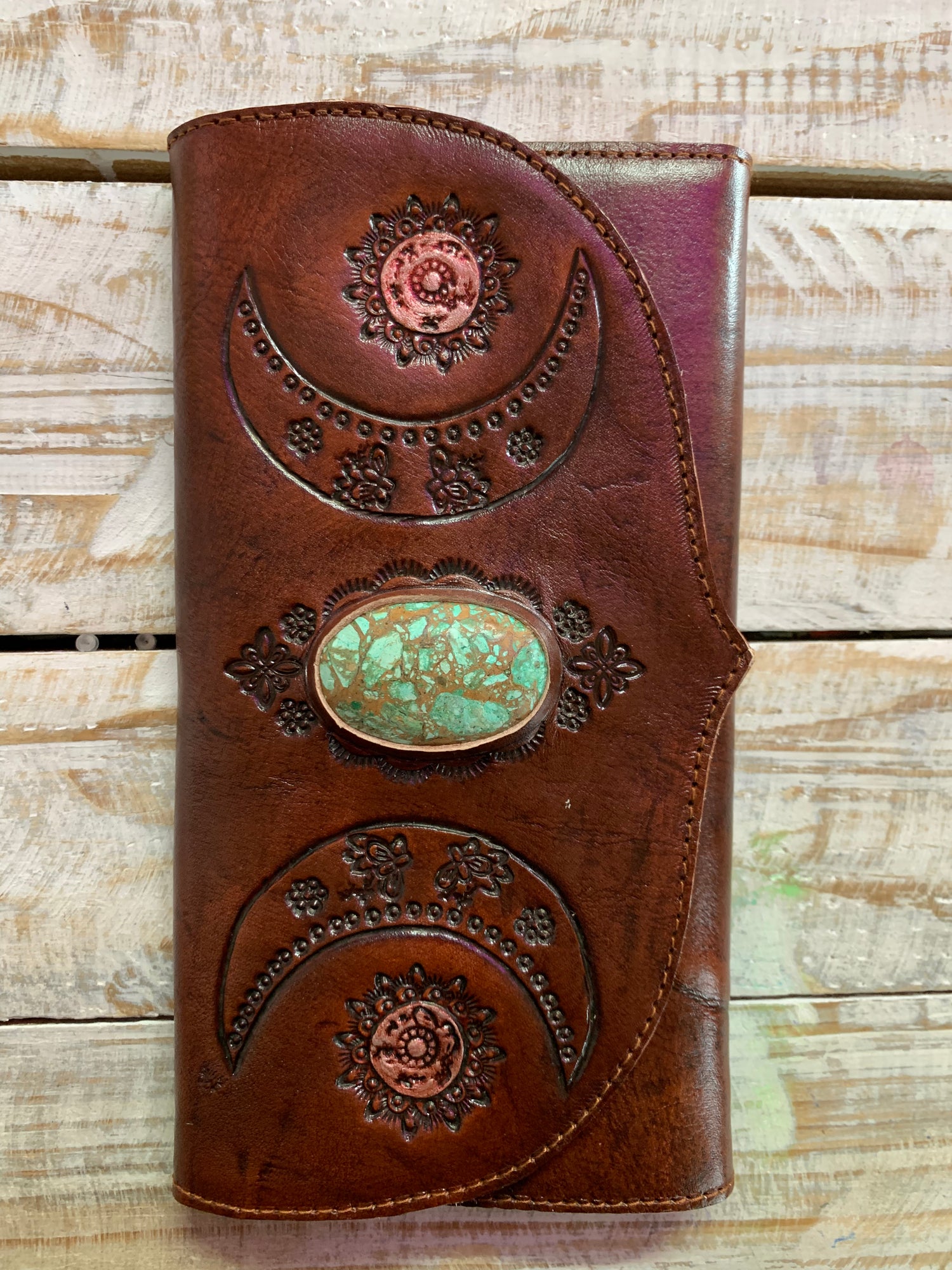 Hand tooled leather purse with chrysocolla crystal feature