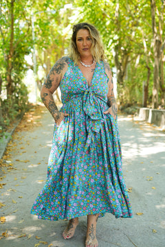 Meet the Jessie Maxi Dress in Aqua Bloom, a dreamy floral maxi with a tie front bodice, plunging neckline, flowing tiered skirt and pockets. Handmade in Bali.