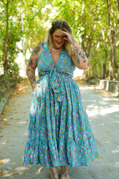 Meet the Jessie Maxi Dress in Aqua Bloom, a dreamy floral maxi with a tie front bodice, plunging neckline, flowing tiered skirt and pockets. Handmade in Bali.