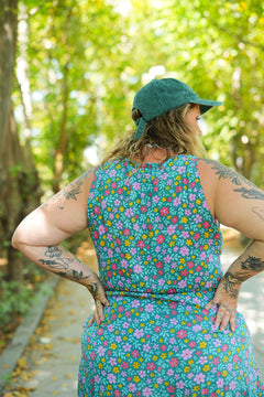 Meet the Jessie Mini Dress in Aqua Bloom, a playful floral mini with an adjustable bust tie, elastic waist, frilled hem and pockets. Handmade in Bali.