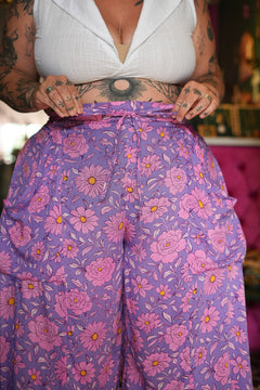 Meet the Kirana Pants in Sugarbloom. Floaty rayon wide leg pants in our dreamy purple and pink floral print, with an elastic waist, drawstring and pockets.