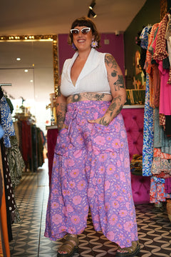 Meet the Kirana Pants in Sugarbloom. Floaty rayon wide leg pants in our dreamy purple and pink floral print, with an elastic waist, drawstring and pockets.