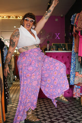 Meet the Kirana Pants in Sugarbloom. Floaty rayon wide leg pants in our dreamy purple and pink floral print, with an elastic waist, drawstring and pockets.