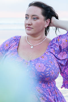 Discover the Love Spell Necklace in Rose Quartz, with blush natural stones, freshwater pearls, gold details and a baroque pearl pendant by Jinx the Label.