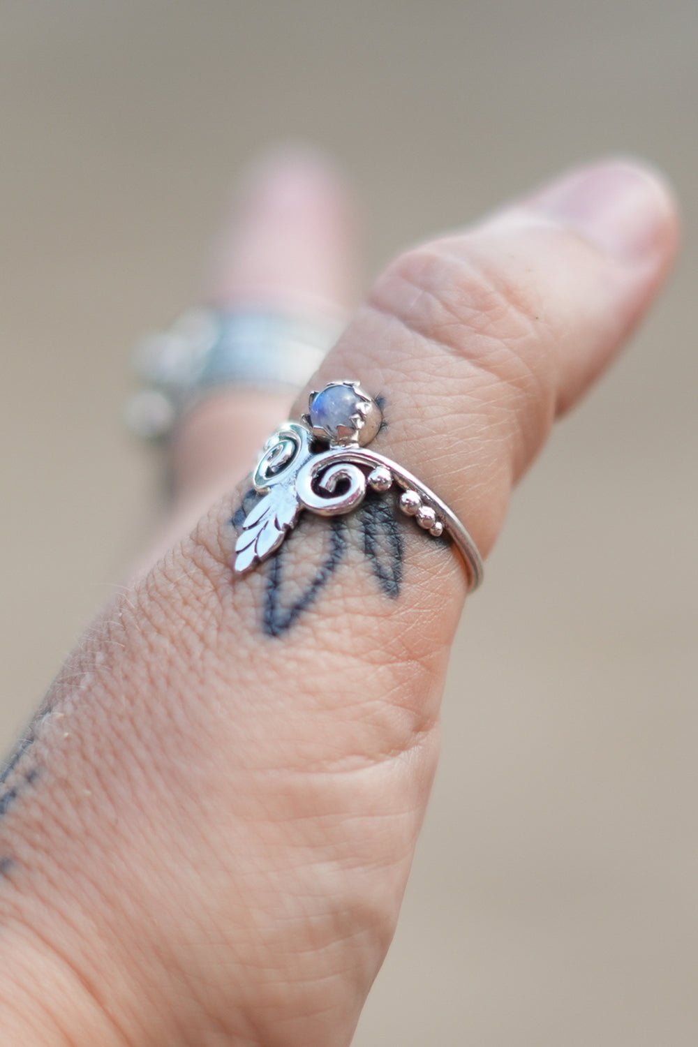 Discover the Luna Ring by Jinx the Label, a delicate sterling silver ring featuring natural moonstone, feather detailing and intricate bohemian silverwork.