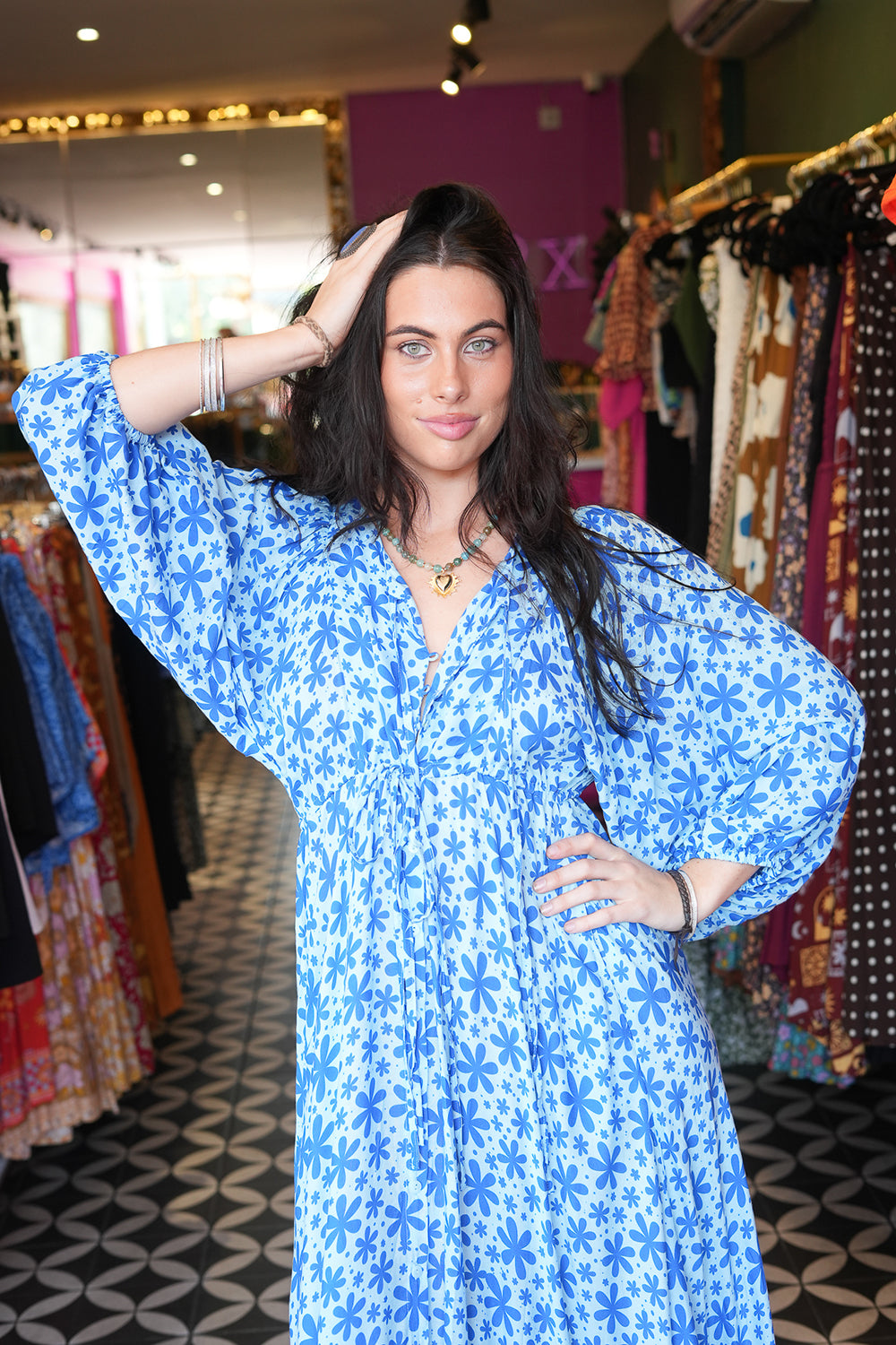 Meet the Magnolia Dress in Floral Blue, a flowing floral boho maxi with billowy sleeves, shell buttons, adjustable waist tie and pockets. Handmade in Bali.