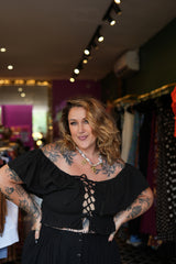 Maria Top in soft black cotton with an off-shoulder ruffle neckline, adjustable lace up front and shirred waist. Handmade in Bali by Jinx the Label.