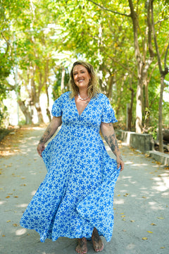 Shop the Mary Maxi Dress in Blue Floral Magic, with butterfly sleeves, deep V-neck and a flowing full-circle skirt. Handmade in Bali by Jinx the Label.